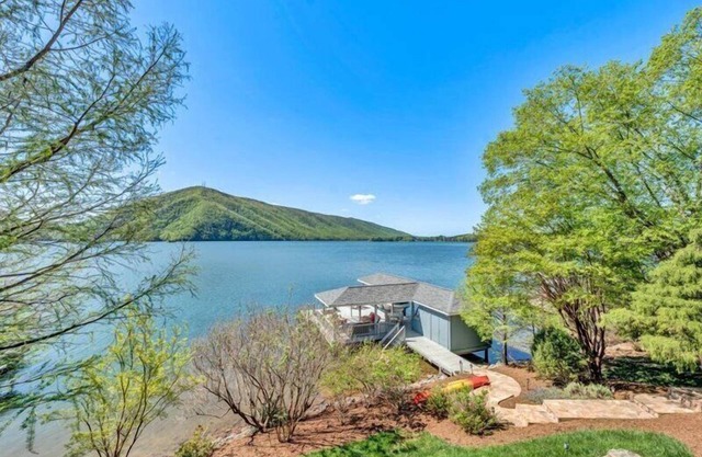 Beautiful lakefront home with wide water and mountain views! Come Visit "Deep Blue View"!