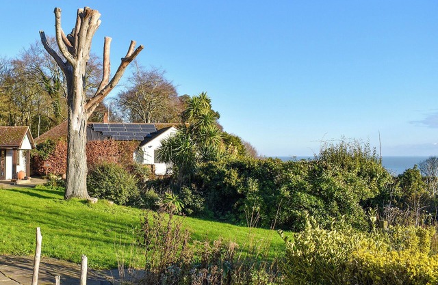Stunning property in picturesque gardens with sea views and lovely walks nearby.