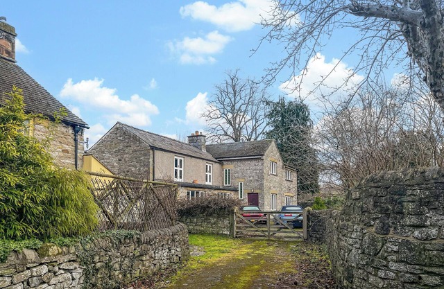 A generously sized cottage located in the quaint Derbyshire village of Ashford-in-the-Water.
