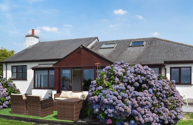 An incredibly spacious retreat flanked by breathtaking views and gorgeous gardens.