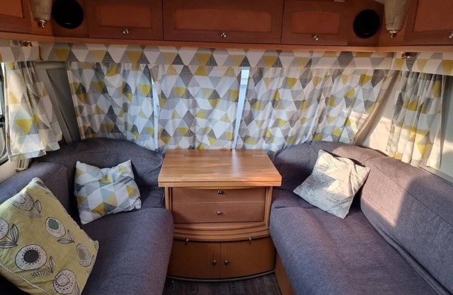4 berth caravan in a garden, nestled in the trees