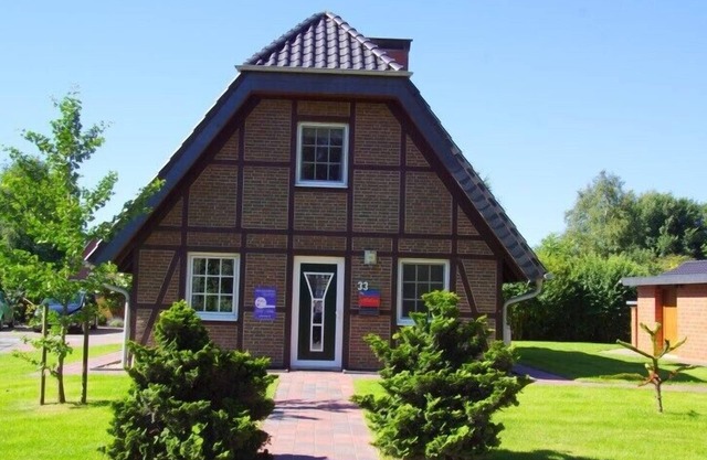 4 person half-timbered vacation home with 2 bathrooms and fireplace in the first row to the dike in Otterndorf