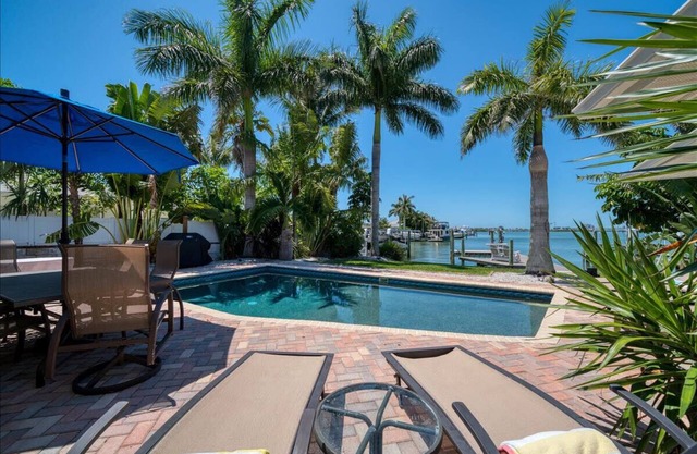 456 Waterfront w/Dock, 3/Br Home Heated pool with Golf Cart in IRB Sleeps 10