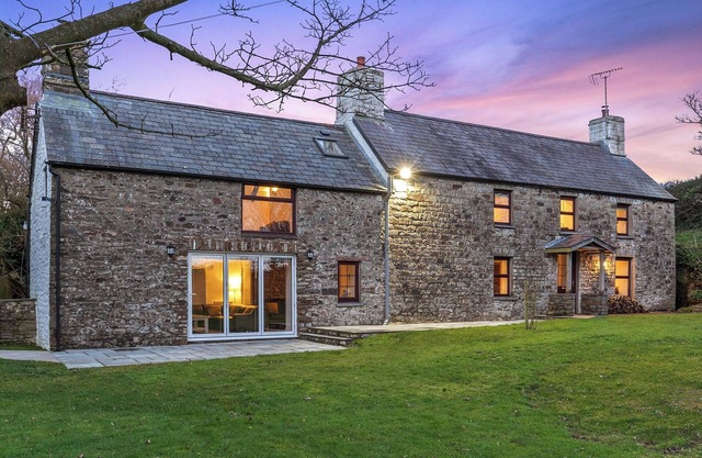 This eighteenth-century farmhouse boasts a wealth of original features, character, and charm.