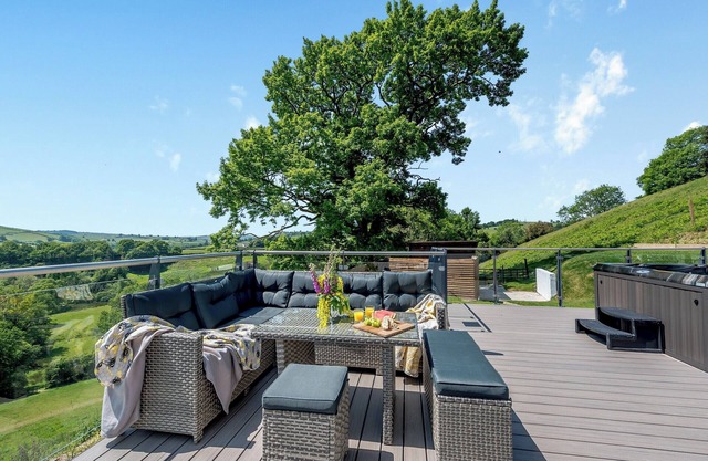 A superb property with fabulous views over the rolling hills; it also has a private hot tub.