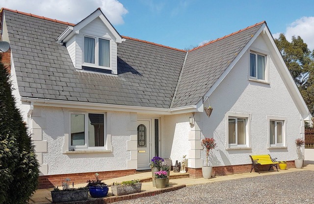 A spacious holiday home with a heavenly hot tub close to stunning beaches.