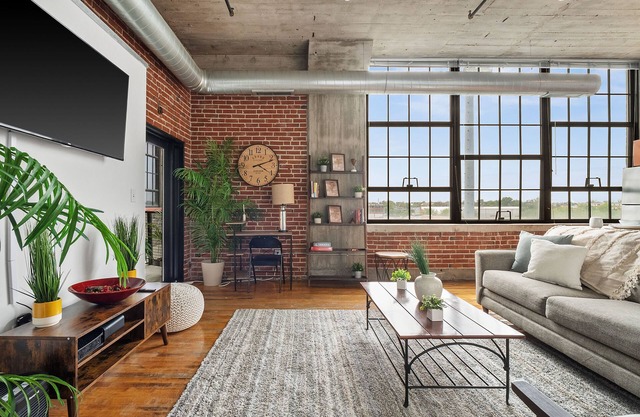 5th floor loft featuring a private balcony