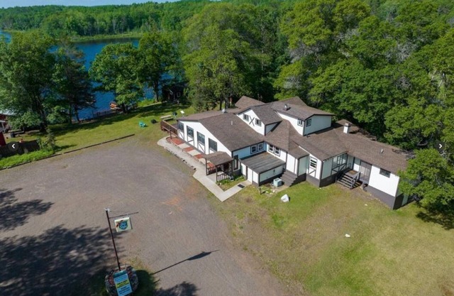 6 BED/4 BATH, RESORT/LODGE ON LAKE IN SPOONER! ENJOY LAKE LIFE, FISHING & TRAILS
