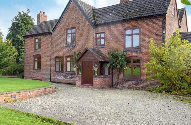 Detached Grade II listed property with large gardens, spacious accommodation and private hot tub.