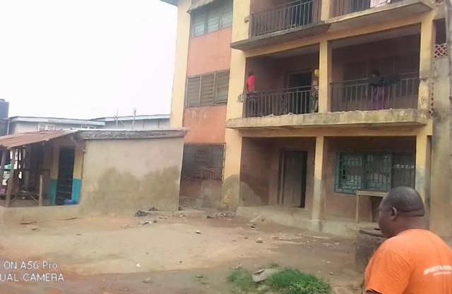 A 2-story building with 2 shops