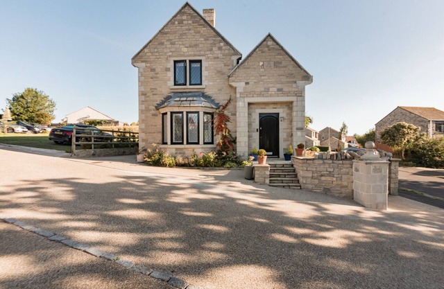 Une maison joliment meublé, à Swanage avec parking bien équipé pour les enfants