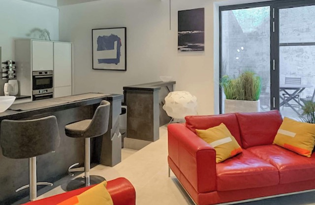 A concrete themed one bedroom apartment.