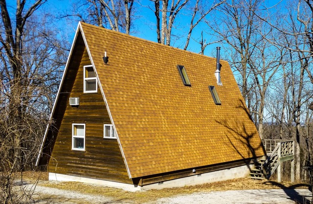 A-frame cabin near downtown with a pool, AC, & fireplace