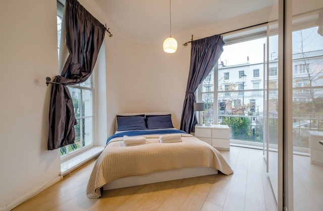 A Rare Gem in Notting Hill: Stunning Two-Story Flat with Sunny Conservatory