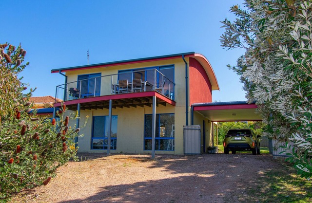 A two- story house with sweeping views of Bass Strait and the North Arm.