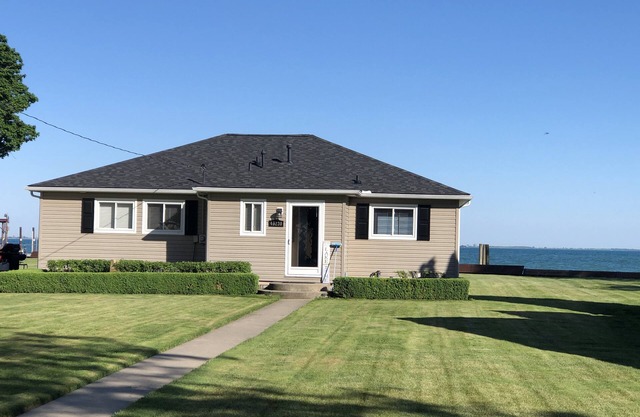 Adorable 4 bedroom lakefront home with dock on a quiet street
