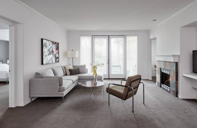 AKA Residences Sharply Appointed Suite w/ Kitchen, Den Space, Patio, & WiFi
