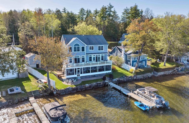 Amazing 4 bed/4 bath home right on Lake Winnisquam w terrific views, hot tub