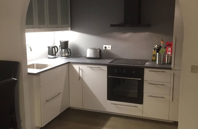 Apartm. dans une maison familiale avec 2 chambres. et un salon avec 2 lits