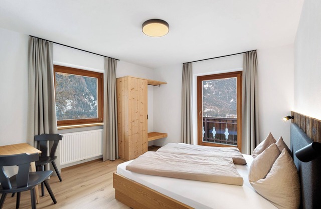 Appartement 'Pfaffingerhof Antholzer See' avec vue sur la montagne, jardin partagé et Wi-Fi