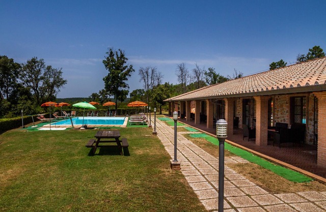 Appartement "Casa Vacanza Il Carpignone 5" avec vue sur le lac, piscine partagée et jardin