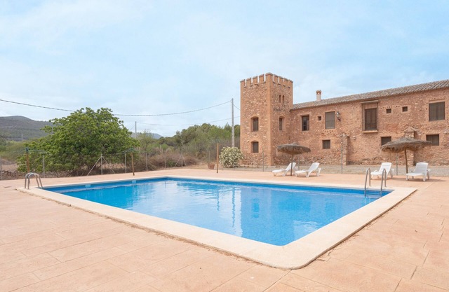 Appartement 'Casa Pablo' avec vue sur les montagnes, piscine et jardin partagés
