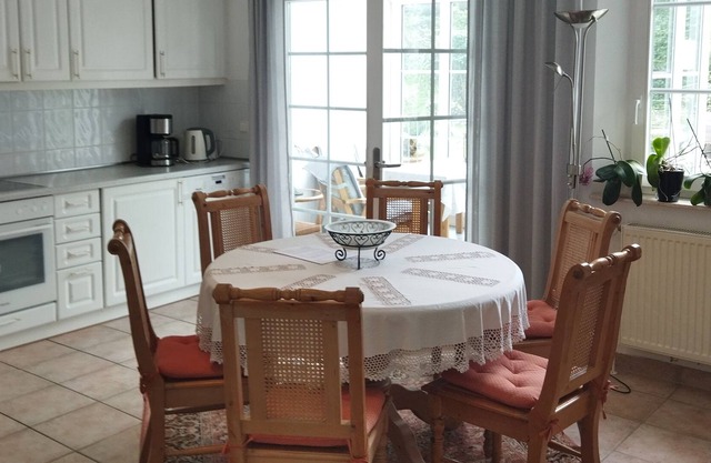 Apartment 11 with a sunny winter garden and garden view near the Baltic Sea coast