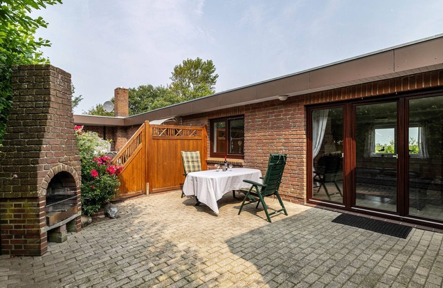 Appartement 'Ferienhaus Alter Deich' avec terrasse privée, jardin privé et Wi-Fi