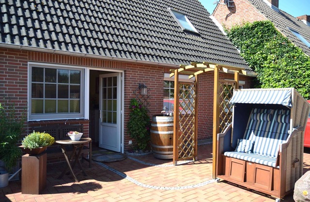 Appartement 'Ferienwohnung Südermarsch' avec terrasse privée, jardin partagé et Wi-Fi