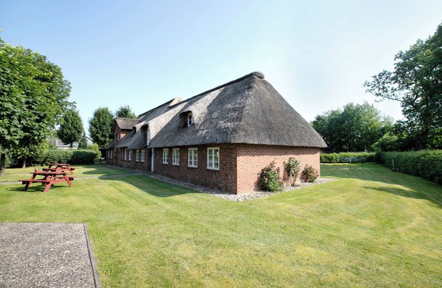 Appartement "Friesisches Reetdach-ferienhaus" avec terrasse privée, jardin privé et Wi-Fi