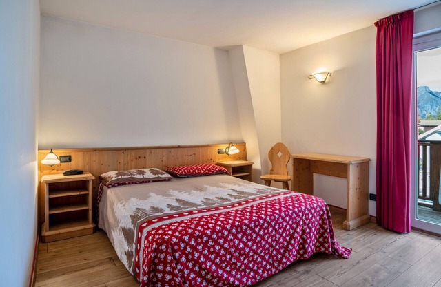 Appartement 'Giongo Residence Aparthotel 103' avec vue sur la montagne, terrasse partagée et Wi-Fi