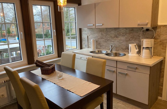 Appartement dans l'ancienne ferme, avec poutres et fenêtres en treillis