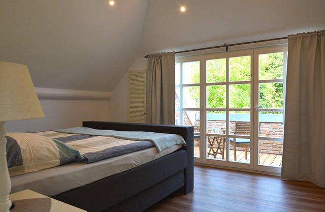 Appartement avec emplacement calme sur le canal à Großefehn