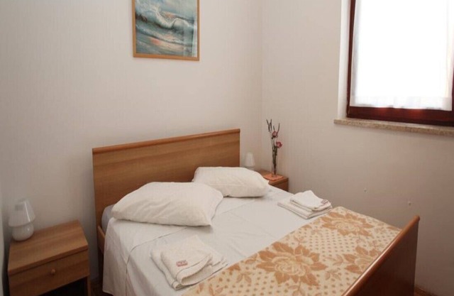 Appartement avec deux chambres et terrasse lit double
