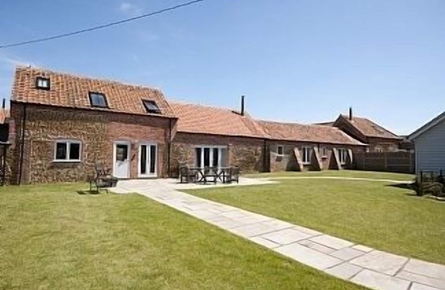 Conversion de grange avec confort de luxe et bel emplacement côtier
