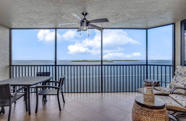 Bayfront escape with beach access, balcony, grill, fast WiFi, central AC, & W/D