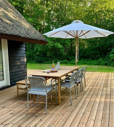 Be Surrounded By Trees In A Thatched Cottage
