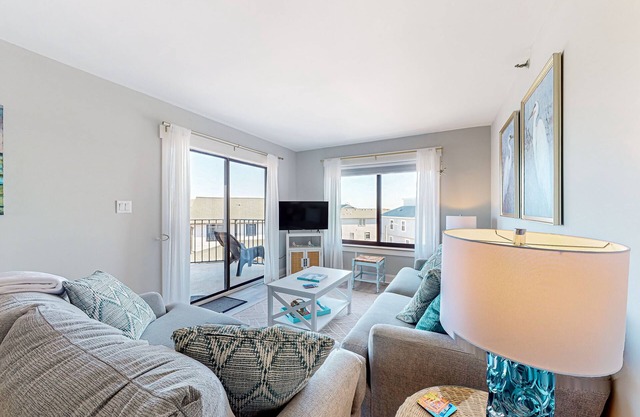 Beachfront condo with on-site pool, ocean view, & private balcony
