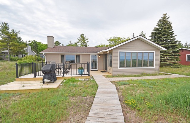 Beachfront cottage with Lake Michigan views, fireplace, gas grill, firepit, deck