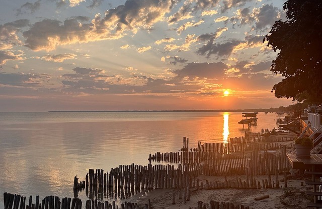 Beachfront lake house with large deck, beach bonfire & stunning views!