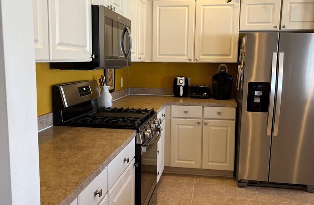 Beautiful, large CY Villa with 2 BR Study fenced yard, golf cart. Small dogs ok.