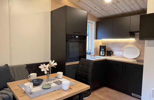 Joli appartement dans une maison de vacances pour 4 personnes avec WIFI, TV, terrasse et parking