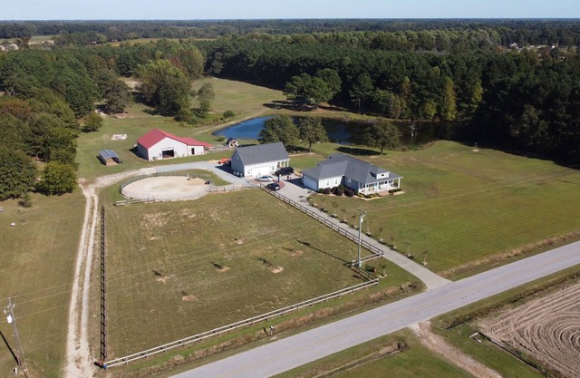 Beautiful Farmhouse with 5 bedrooms on 24 acres of serenity in marvelous Benson.