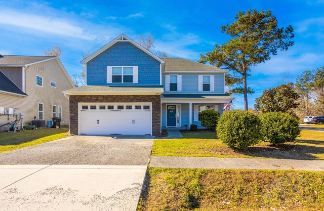 Beautiful home near the coast with a large yard, grill, W/D, and AC