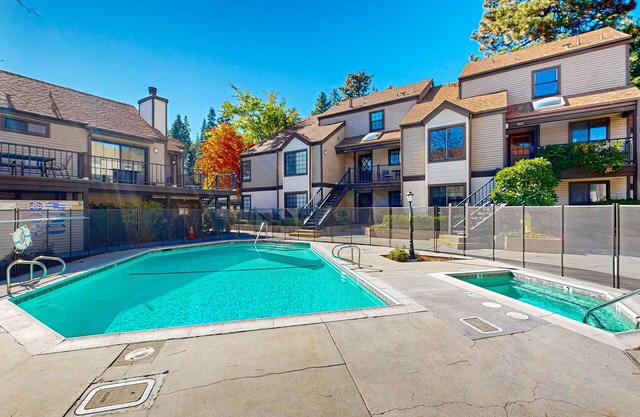 Beautiful lake-view condo w/ shared pool and hot tub walk to restaurants & shops