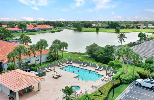 Beautiful North Naples Lake-Front Villa in a Golf Community of Heritage Greens!