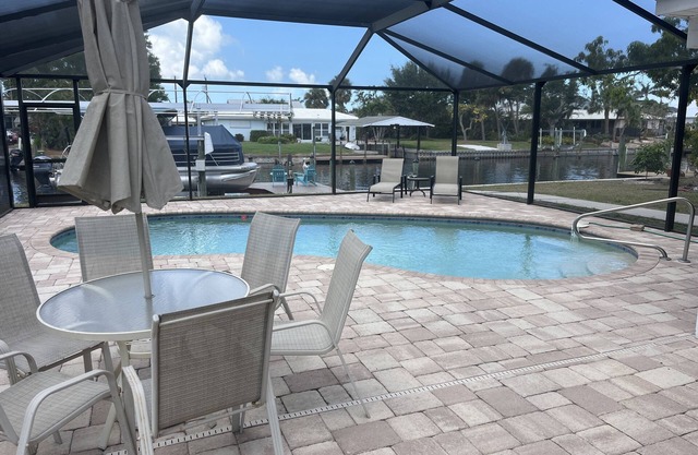Beautiful pool home on canal with 45-foot boat dock. 10 minutes to Gulf by boat.