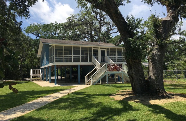 Beautiful , private Bon Secour riverfront home with spacious screened porch