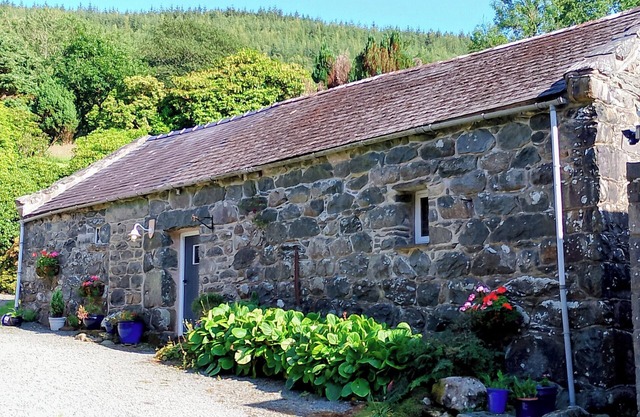 Riverside retreat near Barmouth. Barn conversion with enclosed garden.
