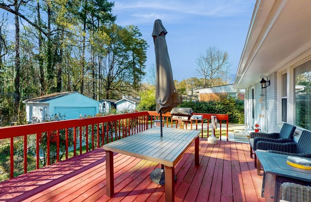 Beautifully renovated home with tree-lined deck, firepit & fireplace